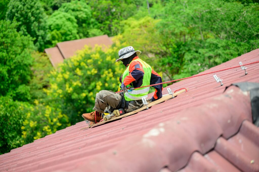 Professional engineer worker installing solar panels system on rooftop